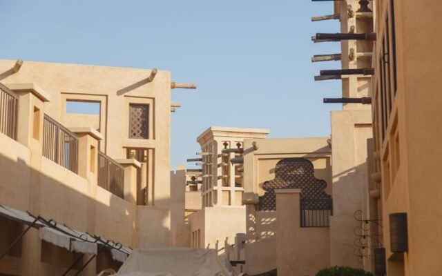 Embrace the blend of traditional and contemporary architectural styles in Dubai, showcasing unique building designs.
