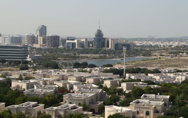 A scenic aerial view of Dubai Silicon Oasis with modern architecture and lush greenery.