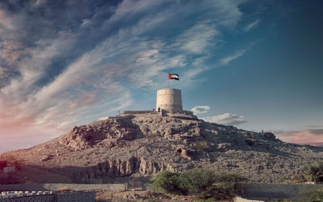 Majestic view of the Hatta Tower under a scenic sky, highlighting UAE's heritage.